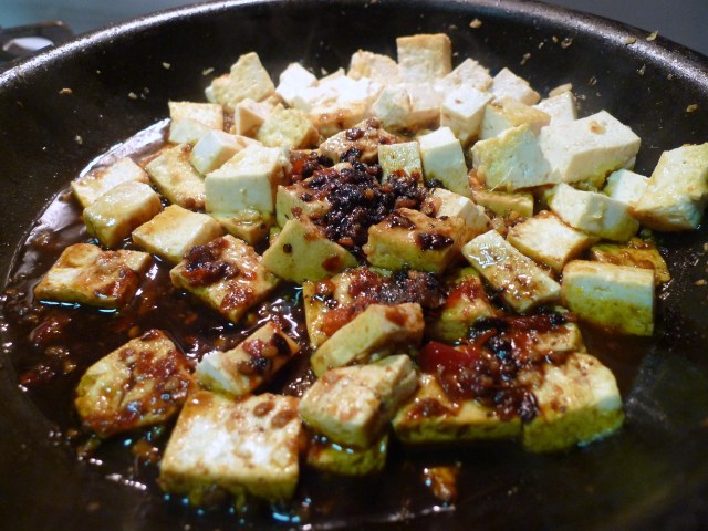 season the tofu with soy sauce, black bean sauce, chili garlic sauce, sugar