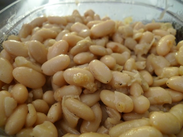 infuse the beans with salt, pepper, and garlic in olive oil