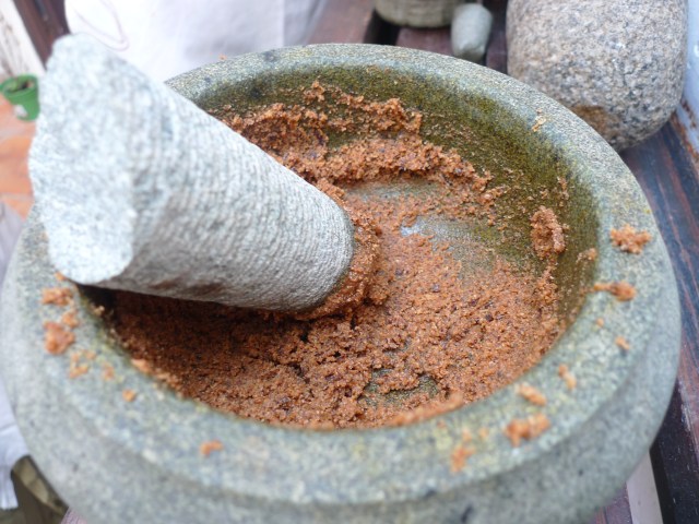 grinding the coconut into a paste