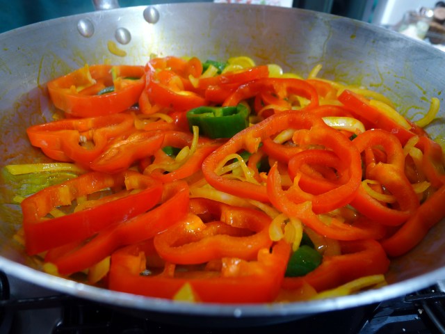 saute the peppers and onions in palm oil