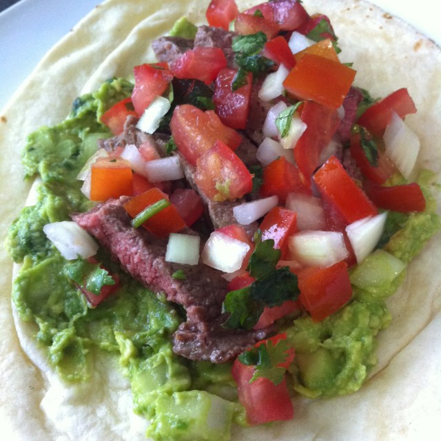 assemble the skirt steak with guacamole and pico de gallo