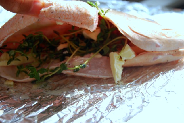 dot the cavity with butter and insert garlic and thyme