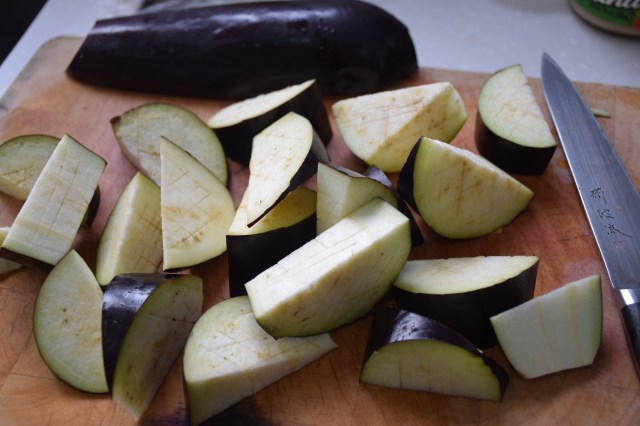 cut aubergine into wedges and score each wedge