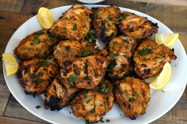 garnish chicken with lemon and cilantro